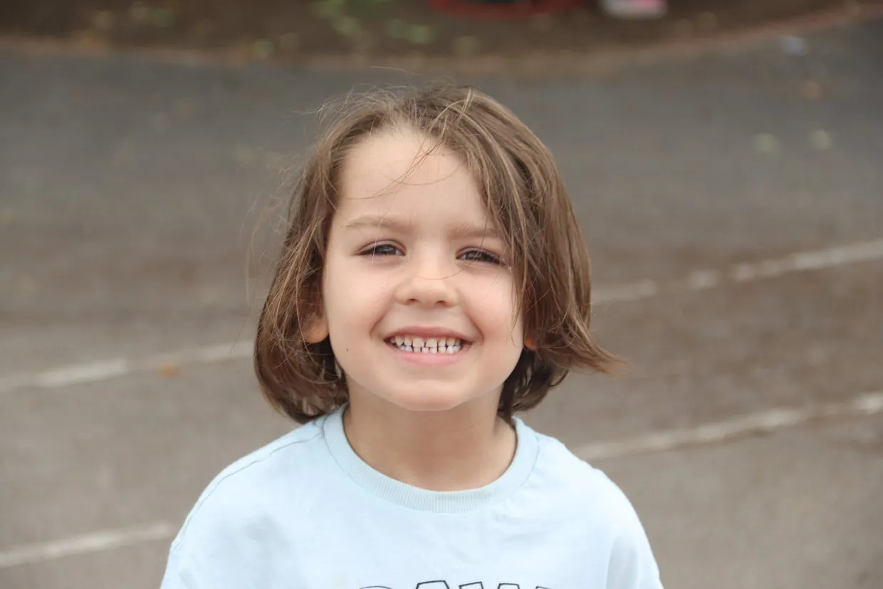 A smiling child at a uSports multi-sports session