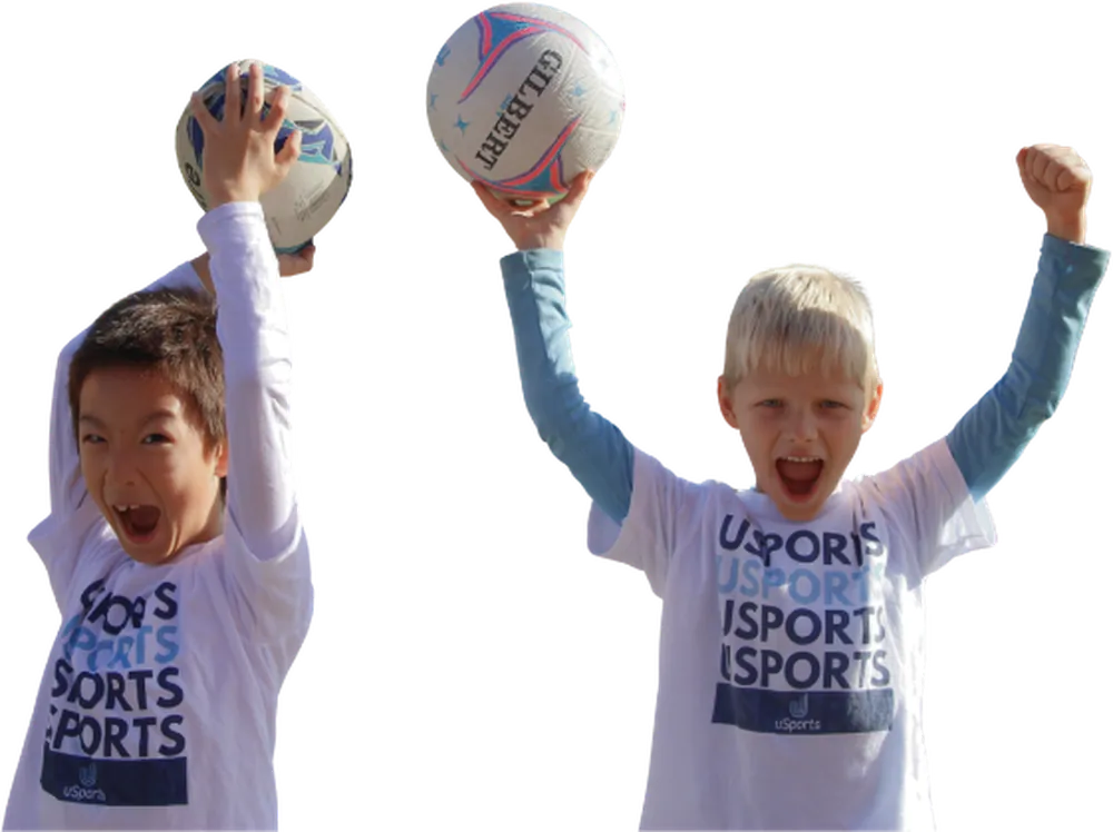uSports campers celebrating with balls raised