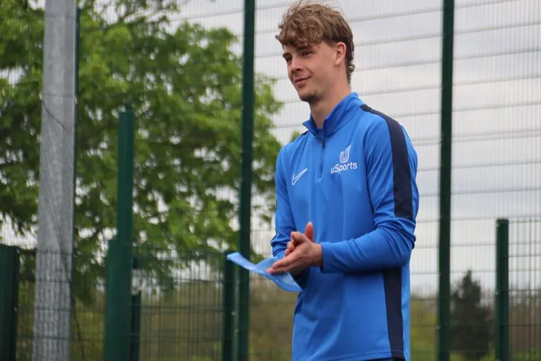 A uSports coach leading a session outdoors