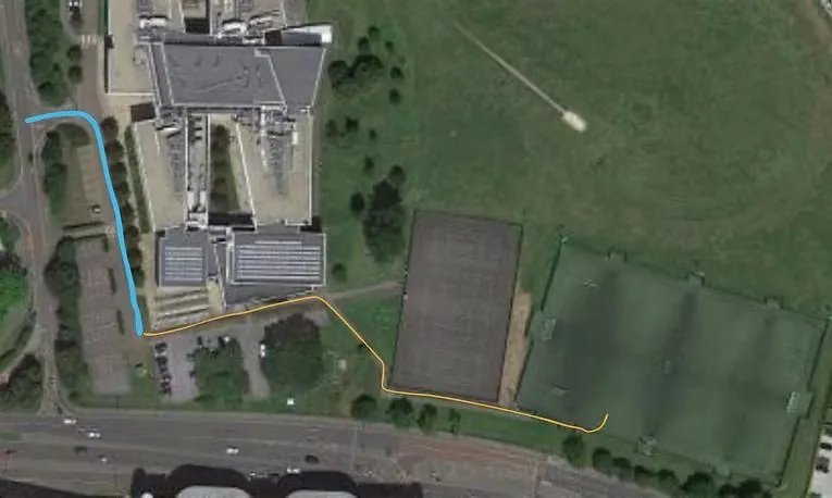 Aerial map of Garth Hill College: a blue line shows the drive to the car park and an orange line shows the walk to the 3G pitch