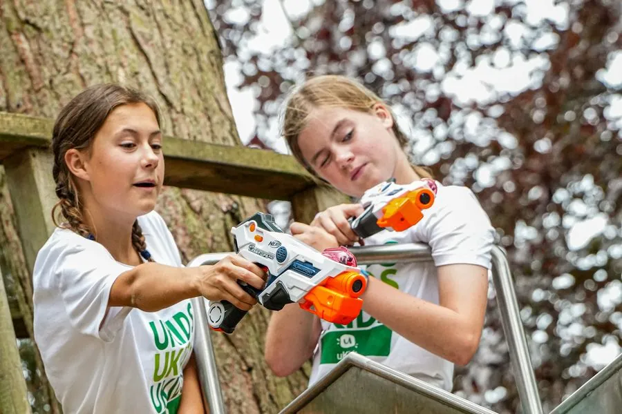 Children playing NERF laser tag at a uKids multi-activity holiday camp