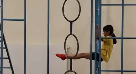 Children creating sequences on the wall bars