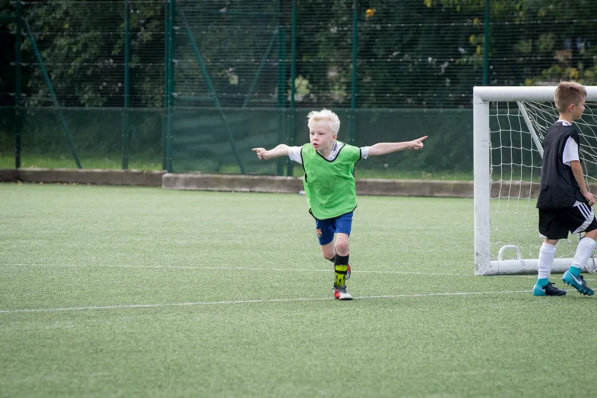 A young player celebrating a goal at a uSports session