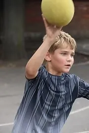 A child throwing a ball at the uSports Thameside summer camp