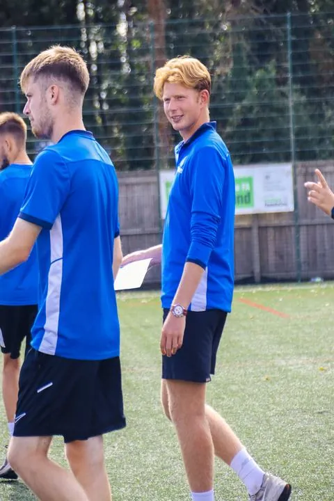 Two uSports coaches on the pitch during a session