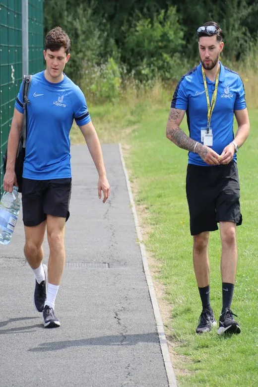 Two uSports coaches walking to a session